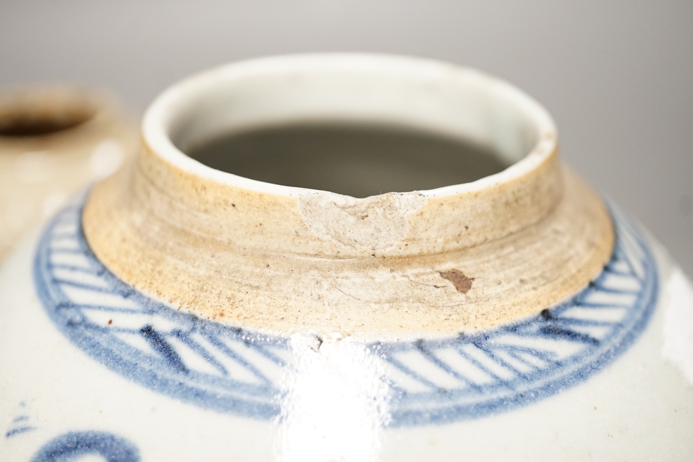 A Chinese celadon jarlet, Yuan-Ming Dynasty, two provincial stoneware jars and a 19th century Chinese provincial blue and white jar, tallest 16cm